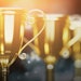 Lineup Of Gold Trophies Adobe Stock 367714926