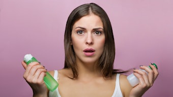 Woman Worried Products Bottles Adobe Stock 122832591