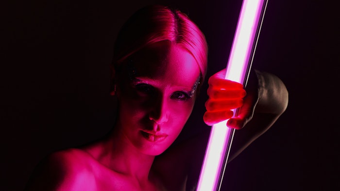 Woman Holding Led Pink Light Light Saber Concept