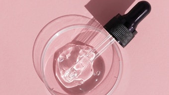 Pink Background Dropper On Glass Disc Clear Liquid
