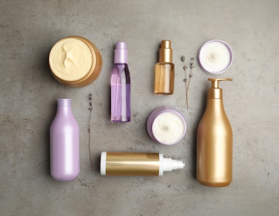 Flat Lay Of Hair Care Products On Gray Stone Purple And Gold Bottles Adobe Stock 414063131 (1)