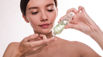 Woman Holding Clear Gel In A Tube Tinted Green Adobe Stock 310885271