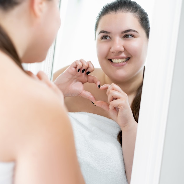 Woman Smiling In Mirror Happy Heart Fingers Adobe Stock 452483001