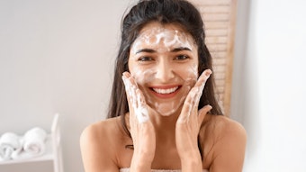 Young Brunette Washing Her Face In Bathroom Foam Smiling Adobe Stock 477816064
