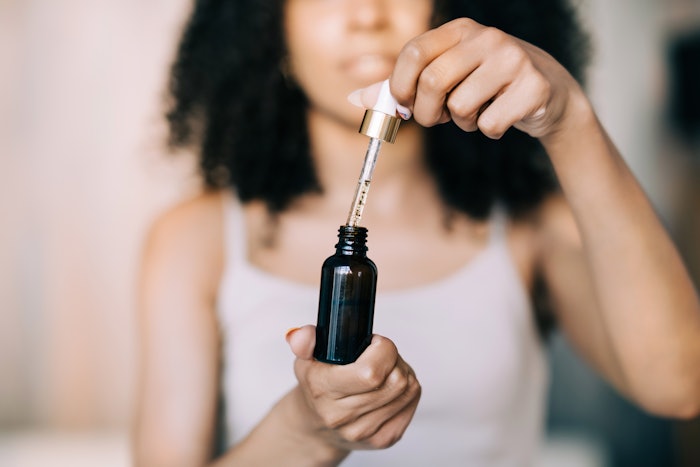 Woman Holding Amber Glass Bottle With Dropper Serum Concept Adobe Stock 516781372