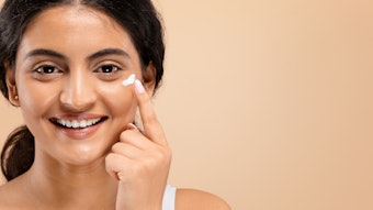 Young Indian Woman Using Eye Cream Smiling Adobe Stock 750183058 (1)
