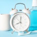 Clock Toothbrush Mouthwash Blue Background Adobe Stock 1352350501