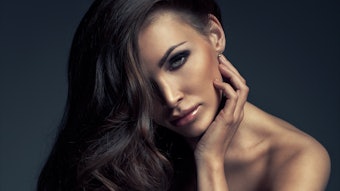 Brunette With Long Shiny Hair Leaning Over A Chair2