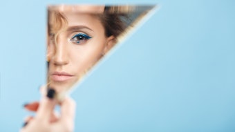 Woman Peeking Triangle Mirror Blue Background Bold Eye Makeup Adobe Stock 242260080