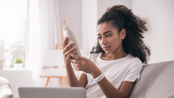 Beauty Consumer At Home Reviwing Product Label Concerned Adobe Stock 203052567