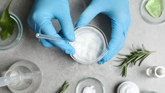 Chemistry Lab Hands Gloved Mising Formulas