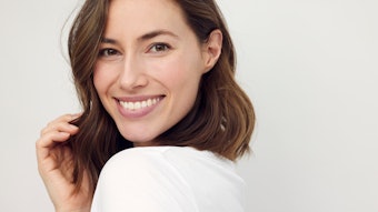 Pretty Young Brunette White Background Touching Her Hair Adobe Stock 493117108