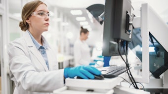 Chemist In Lab Analyzing Information Looking At Computer Adobe Stock 685703561