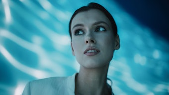 Woman Looking Up Blue Background Water Reflection Simple Model Adobe Stock 635817310 (1)