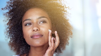 Beautiful Woman Curly Har Tan Skin Lotion On Face Adobe Stock 752212185