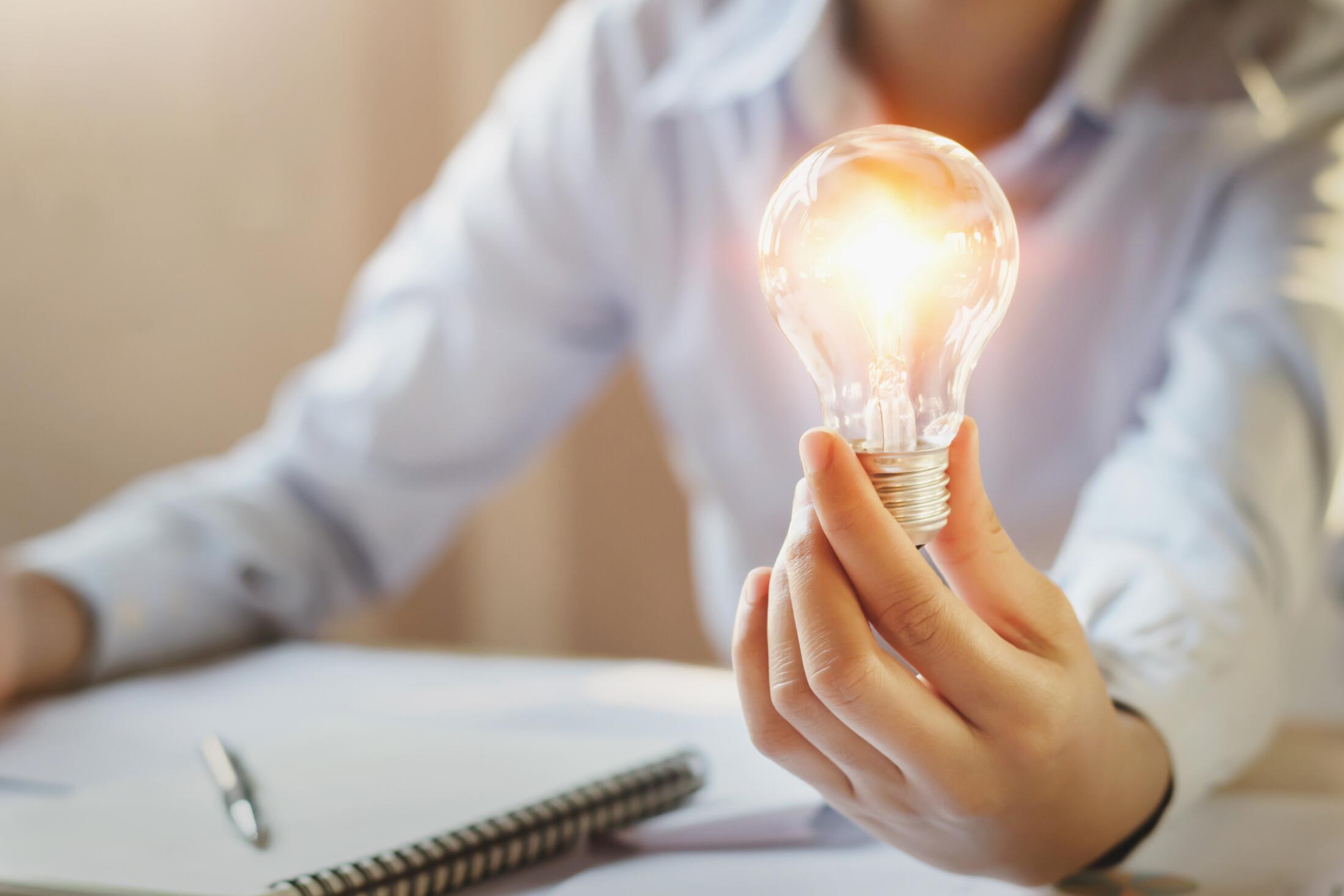 Business Woman Holding Light Bulb Lit Innovation Concept Adobe Stock 220636683