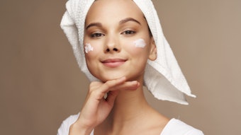 Cute Brunette Towel On Hair Dots Of Lotion On Cheeks Cute Adobe Stock 338984115