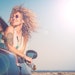 Woman Curly Hair Riding In Car Hanging Out Window Sunglasses And Sunlight Adobe Stock 366509764
