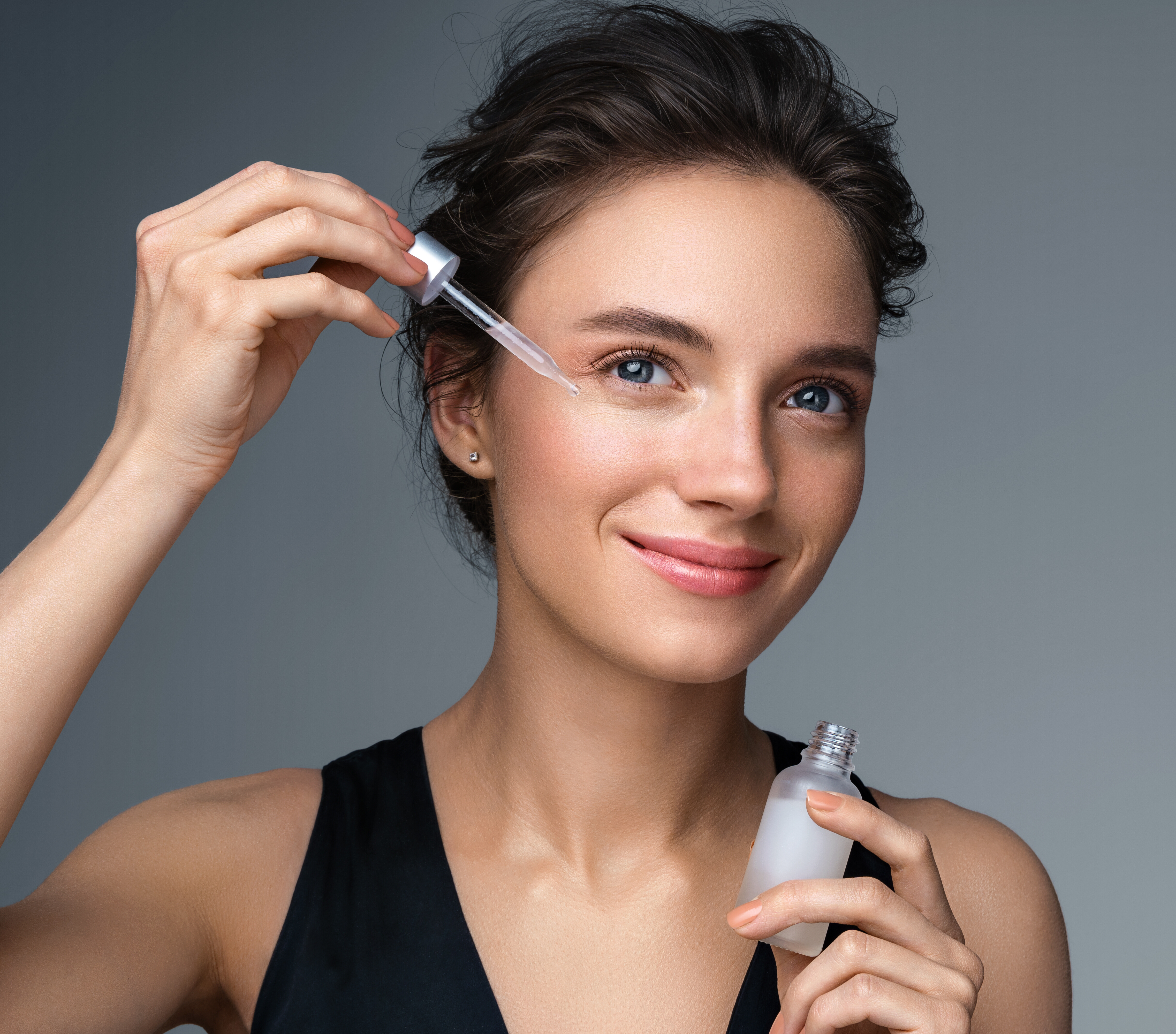 Young Woman Smiling Using Facial Serum Clean Beauty Concept Adobe Stock 368599793