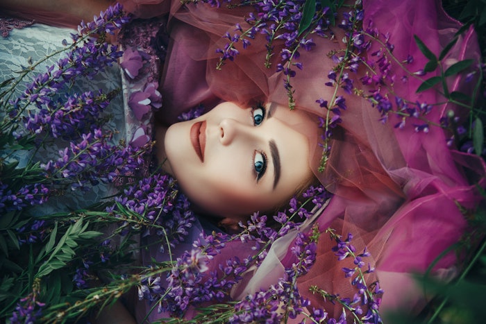 Woman Laying In Purple Flowers Sideways Adobe Stock 251901702