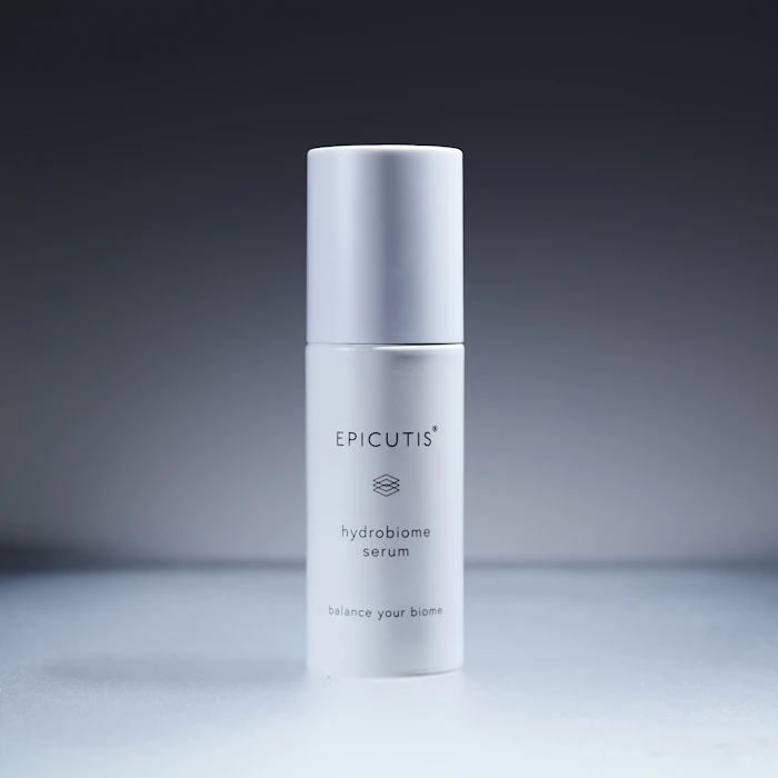 Epicutis Hydrobiome Serum white airless pump bottle with minimalist design on gray background