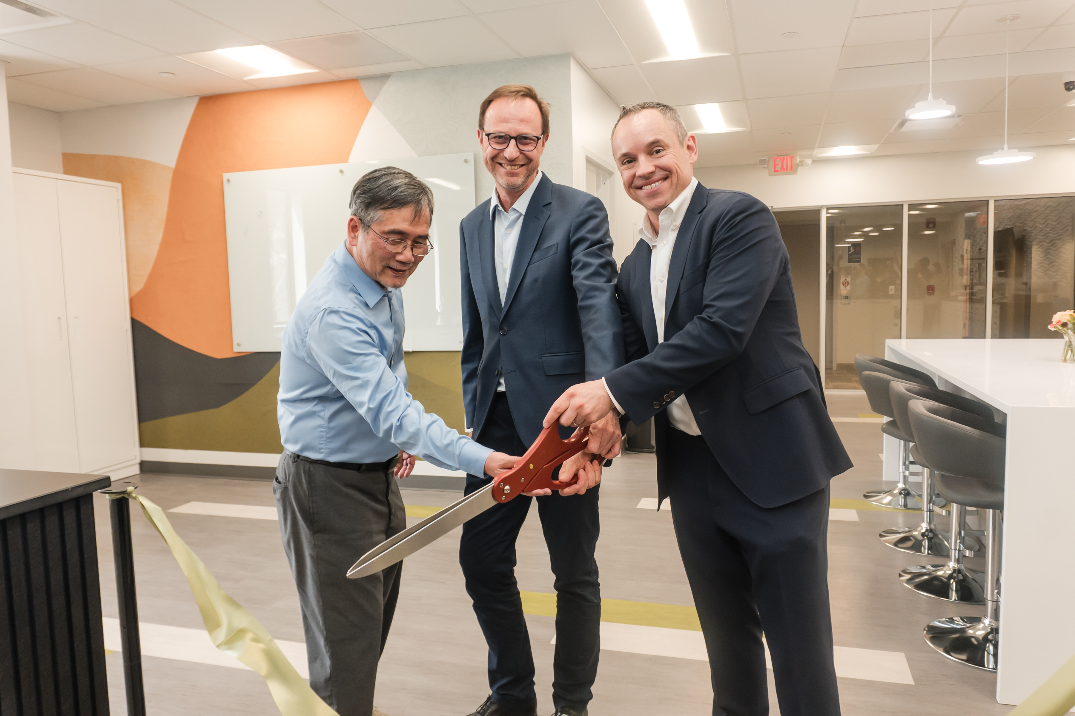 Solabia Executive Leadership Cutting Opening Ribbon