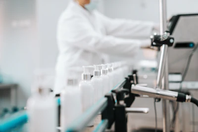 Scientist working in laboratory with test tubes and equipment on workbench